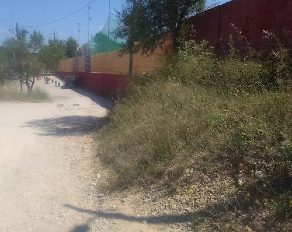 Pavimentació d'un tram de camí de l'esplanada del Puigberenguer